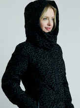 Load image into Gallery viewer, Person wearing a black leopard print hoodie on a gray background
